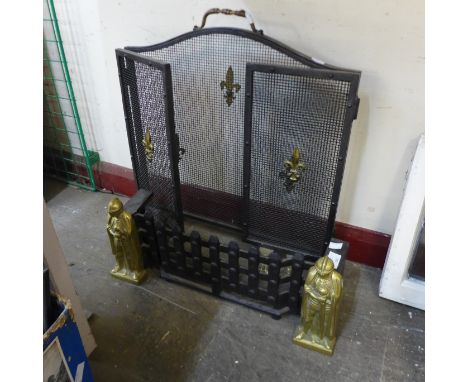 A cast iron fire front and a French fleur de lys fire screen 