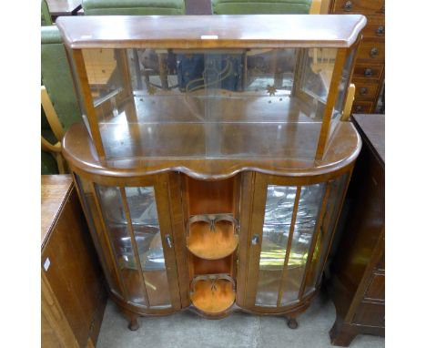An Art Deco walnut cocktail display cabinet 