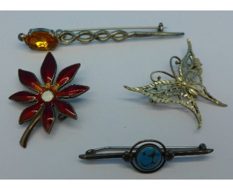 Four brooches including a Norwegian silver and enamel flower brooch, a/f