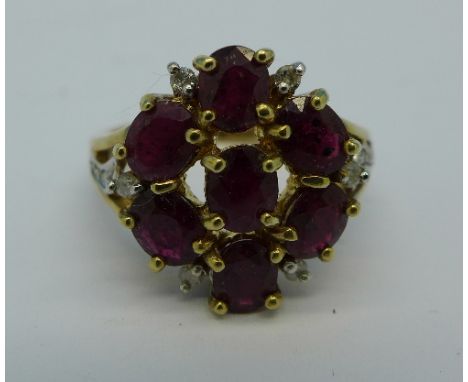 A 9ct gold, ruby and diamond cluster ring, 5g, N