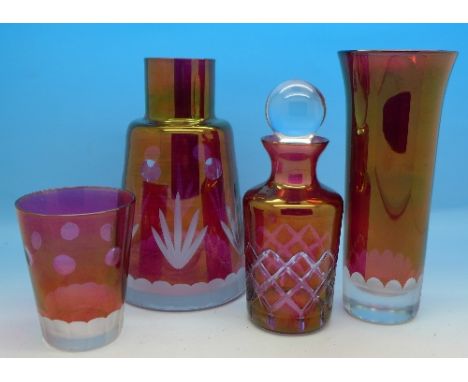 A ruby glass carafe, perfume bottle and vase