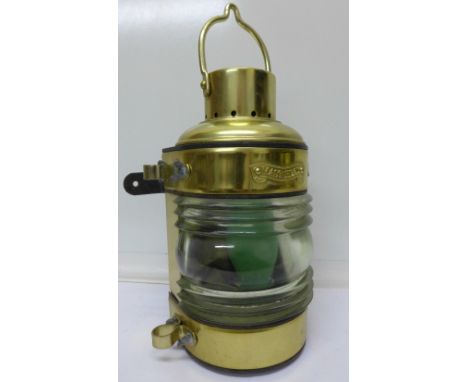 A reproduction ship's lamp, marked Mast Head