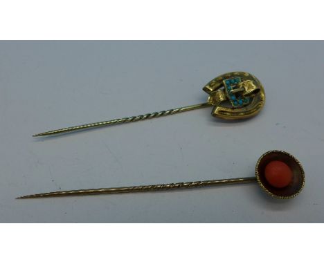 Two yellow metal stick pins