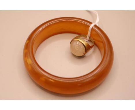 Ladies Yellow metal Opaline set ring and a Early plastic Bangle 