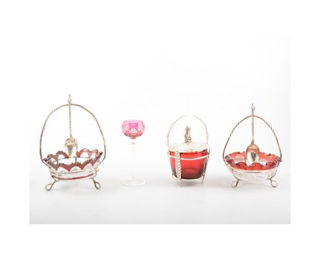 Two glass preserve dishes with ruby glass rims in handmade hallmarked silver frames with overhead handle and spoons, a ruby g