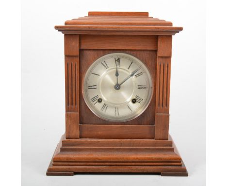 American walnut cased mantel clock, Ansonia Clock Company, New York, silvered dial, movement striking on a gong, 32cm.