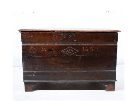 Boarded oak coffer, bearing initials and date, M. S.,1631, two planked top, bracket feet, width 87cm.