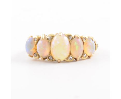 An opal and diamond half hoop ring, the oval cabochon cut stones claw set in an all yellow metal carved claw mount with ten d