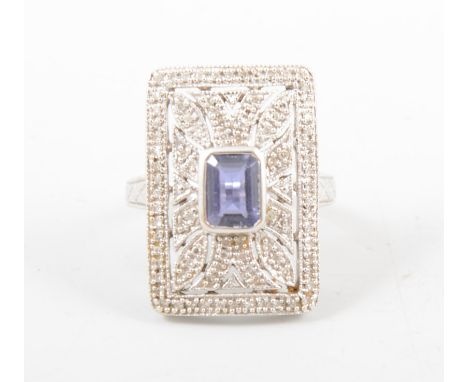 A large 9 carat white gold dress ring, an untested rectangular blue stone tanzanite in colour collet set to centre of a recta