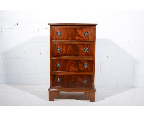 Reproduction mahogany bow front chest of drawers, the top with broad cross-banding and a reeded edge, fitted with four long d