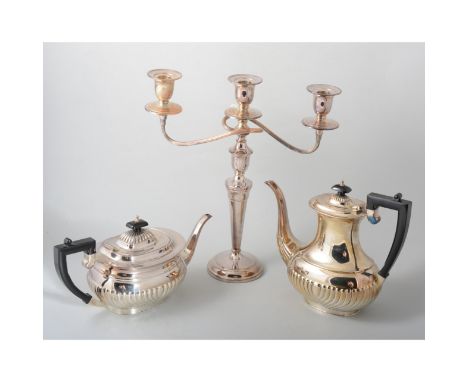 Electroplated three-light candelabra; a pair of matching candlesticks; four-piece electroplated tea and coffee set; and an ov