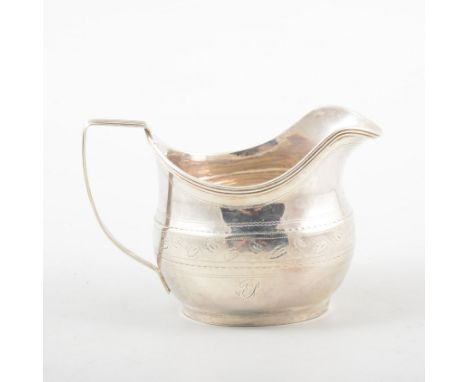 George III silver cream jug, makers mark I. M., London 1810, reeded rim and handle, bright-cut decoration, 9cm.