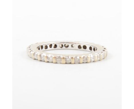 A diamond full eternity ring, twenty-nine brilliant cut diamonds claw set in a white metal full eternity mount, 2.3mm wide, r