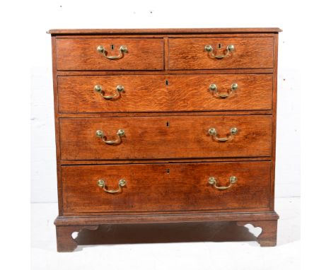 George III oak chest of drawers, fitted with two short and three long drawers, bracket feet, width 96cm.