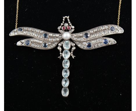 A diamond, sapphire, ruby and aquamarine pendant in the syle of a dragonfly, six oval mixed cut aquamarines to body, eight sa