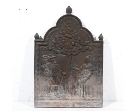 Cast iron fire-back, designed with figures by a fruit tree, double domed top, 76cm and a mesh fireguard, (2).
