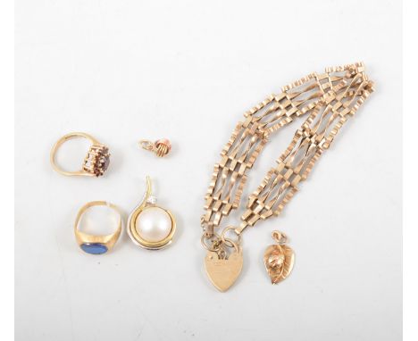 A collection of gold jewellery, 9 carat yellow gold four bar gate link bracelet, three pendant and two rings. gross weight in