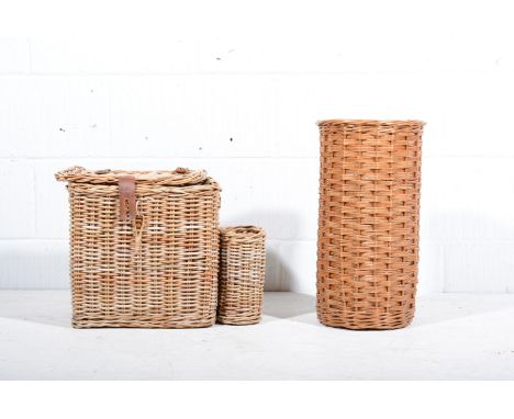 A woven cane fishing basket, width 35cm, three other woven cane items, a bamboo carpet beater and a shooting stick, (5).