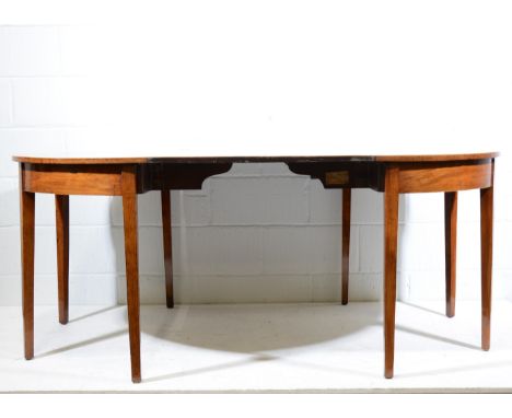 Pair of Georgian mahogany demi lune console tables, tops with boxwood and ebony stringing, plain frieze, plain tapering legs,