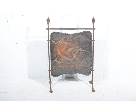 A Newlyn inspired firescreen, metal frame with copper panel depicting a galleon, lion motif to sail, overall width 52cm.