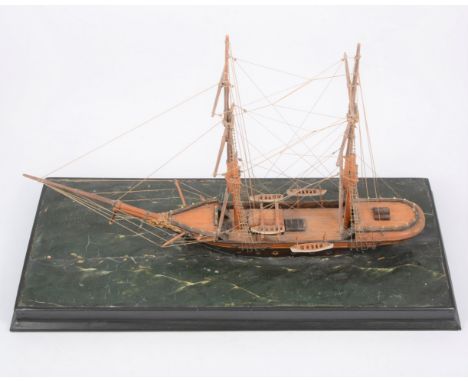 A model scale sailing boat, on custom-built base of rough sea, 45cm in length.