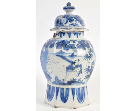 A believed 17th Century Chinese antique porcelain vase and cover with hand painted blue and white decoration depicting figure