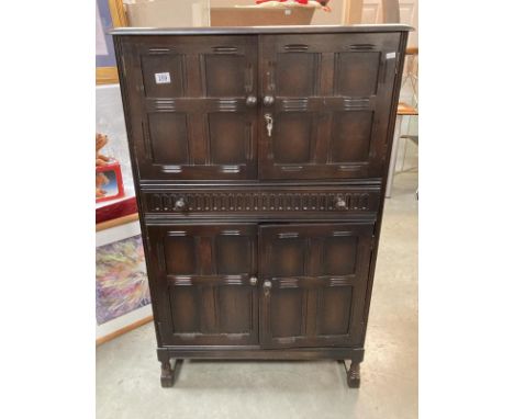 A vintage dark oak drinks cabinet with mirrored back  COLLECT ONLY128 h x 81 w x 43d cms