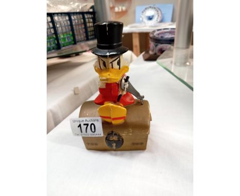 A vintage Disney Scrooge Mcduck Sheffield trustee savings bank TSB money box with key
