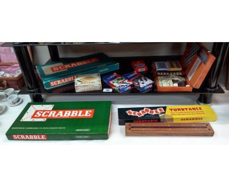 A quantity of games including Scrabbles &amp; cribbage board