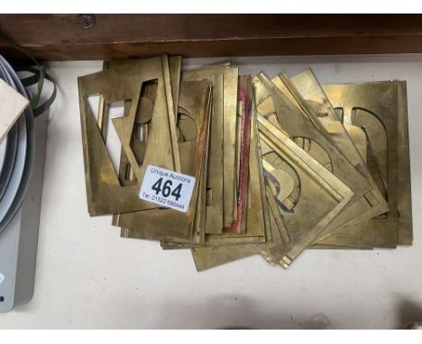 A quantity of vintage brass stencils 