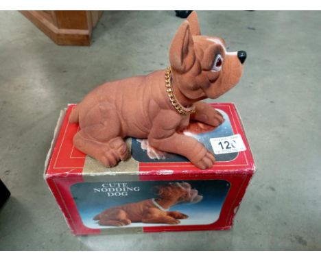 A vintage boxed nodding dog