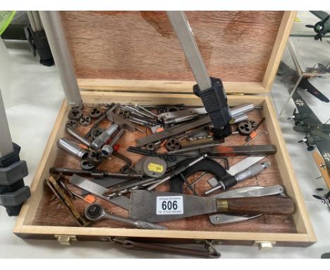 A box of engineering tools including taps, dies, micrometer etc