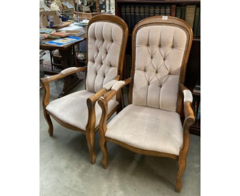 A pair of upholstered button back arm chairs. COLLECT ONLY.