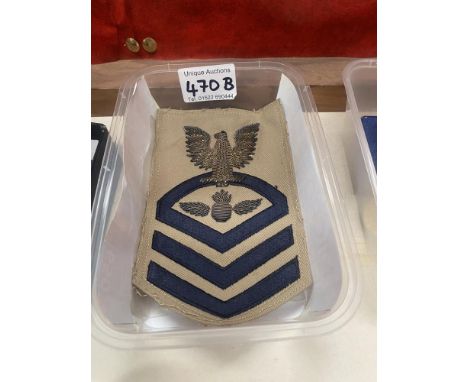 A set of military ribbons and a US Navy Boatswain's mate Chief Petty Officer bullion rate patch.