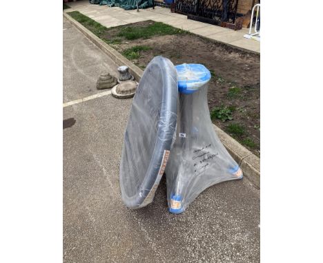 A heavy garden table on pedestal, unused