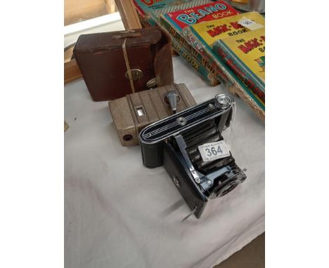 A G B Bell Howell vintage camera and an Agfa folding camera.