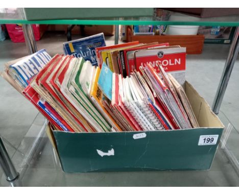 A box of vintage road maps