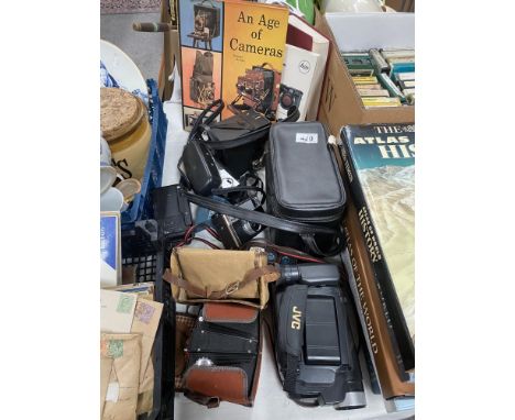 A selection of vintage cameras and books etc
