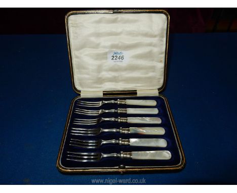 A set of six Silver fish forks, Sheffield, 1917, makers J.A.S, possibly James A. Scholes, with mother of pearl handles.