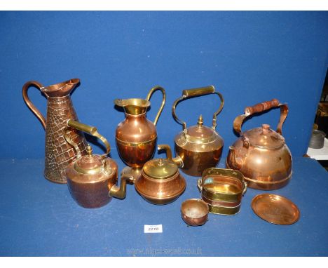 A quantity of brass and copper to include jug with scale design, kettles, jug, lidded pot, etc.