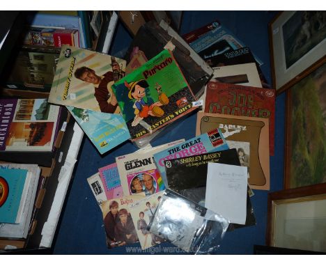 A quantity of LP's to include; Shirley Bassey, Brass Bands, Joe Cocker, Status Quo. Together with a selection of 33 rpm and s