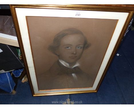 A framed and mounted Charcoal Portrait of a young gentleman 21 1/4" x 27".