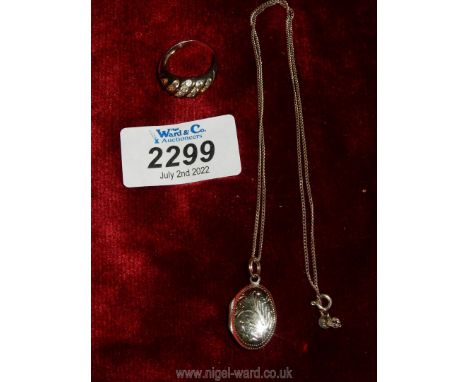 A vintage silver ring set with 18 clear stones, stamped 925, plus an oval locket and chain, stamped 925.