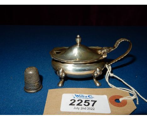 A Silver salt and spoon, Birmingham 1967 with maker mark rubbed (possibly S&amp;M) together with a silver thimble, Chester po