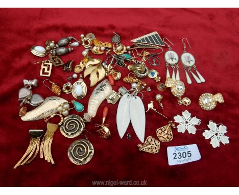 A quantity of mixed earrings including Mexican silver with mother of pearl inlaid flowers, clip on, drop earrings, etc.,