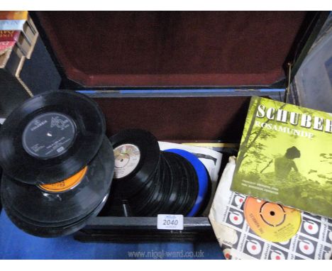 A small wooden trunk containing unsleeved 45 rpm records to include; Tom Jones, The Shadows, Benny Hill, etc.