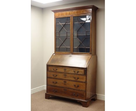 Early 19th century inlaid mahogany bureau bookcase, astragal glazed doors, fall front with fitted interior, four graduating d