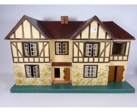 Vintage Tri-ang twin gable dolls house with some furniture, H51cm x L86cm   Condition Report   Click here for further images,