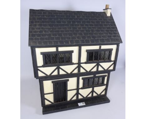 Vintage Tudor style dolls house with some period style furniture, H55cm x L38.5cm   Condition Report   Click here for further