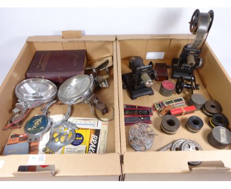 Early 20th Century film and slide projectors, vintage film and slides, car badges, head lamps etc in two boxes   Condition Re